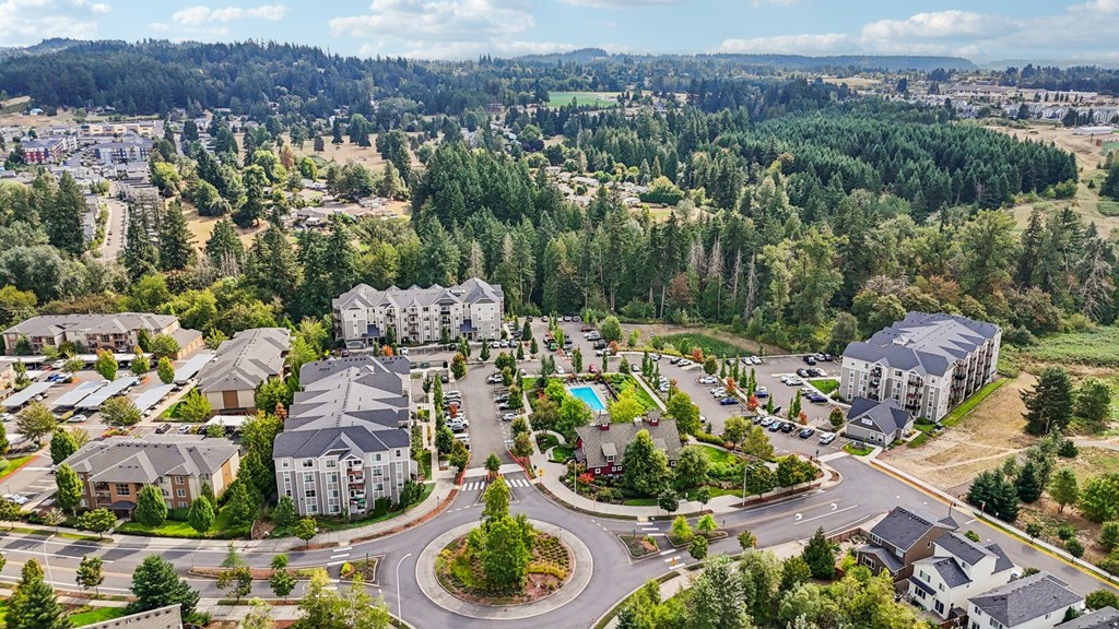 A bird's eye view of a residential area with a large building in the center.