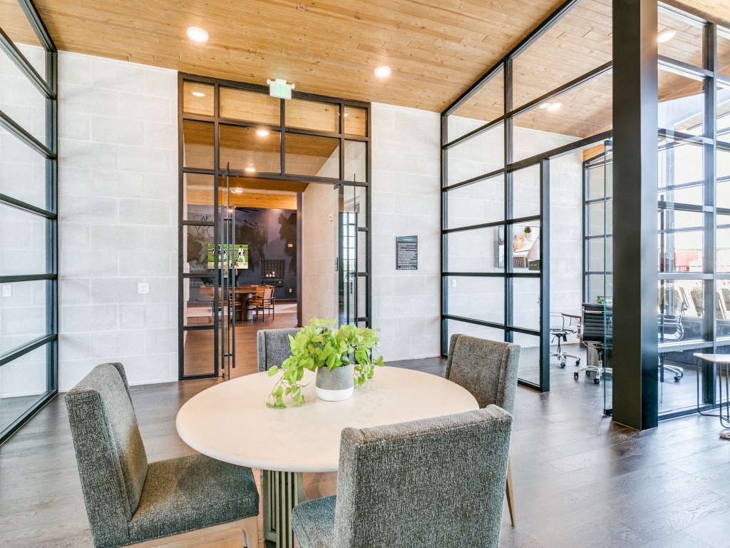 a conference room with a round table and chairs