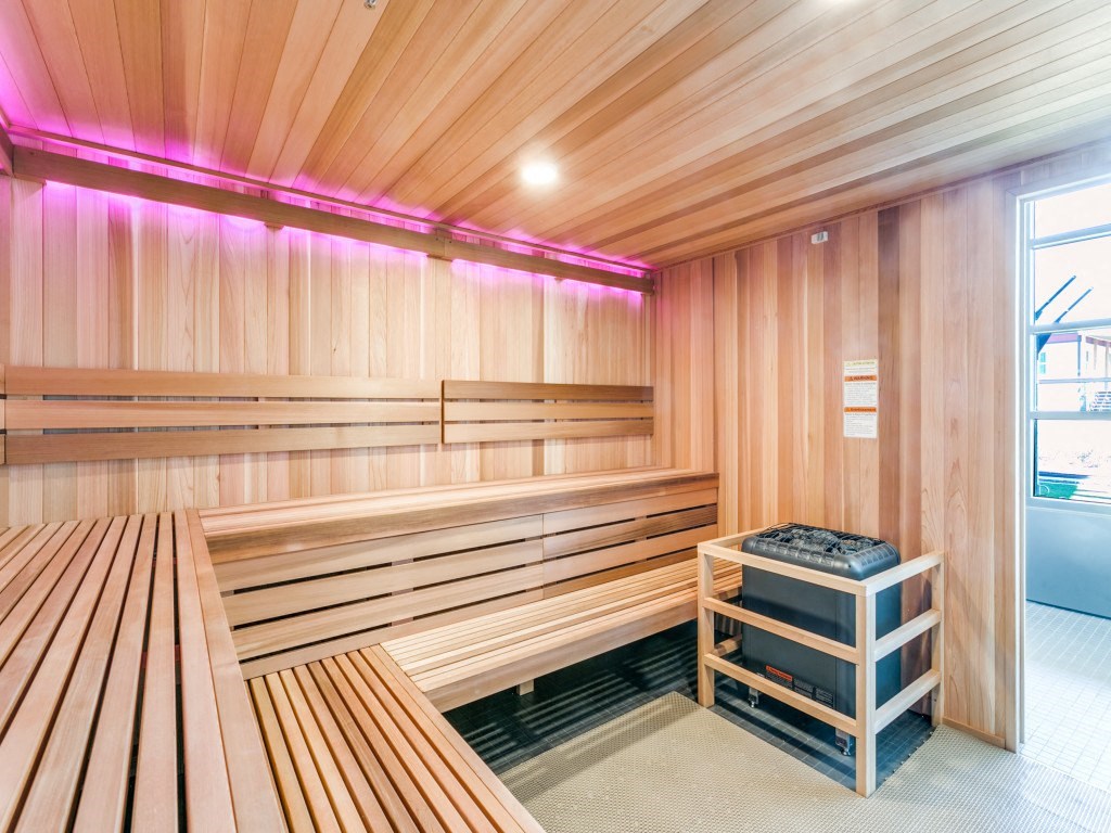 a wooden sauna with benches and a table