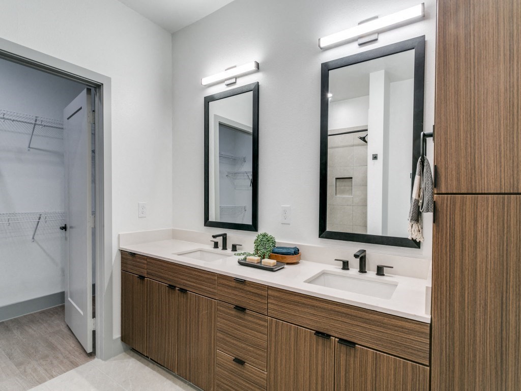 the preserve at ballantyne commons modern bathroom with two sinks and two mirrors