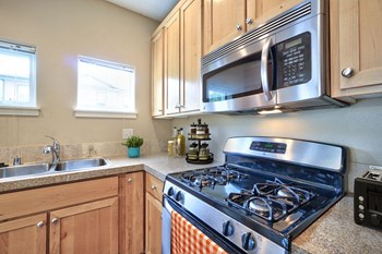 Washougal, WA Lookout at the Ridge Apartments staged kitchen featuring gas stove - Photo Gallery 6