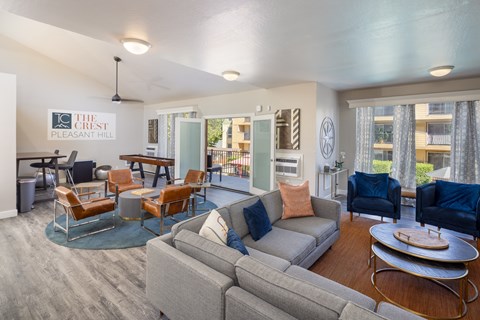 A living room with a grey couch and a coffee table.