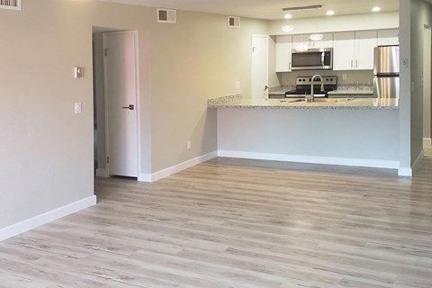 A kitchen area with a countertop and stainless steel appliances.