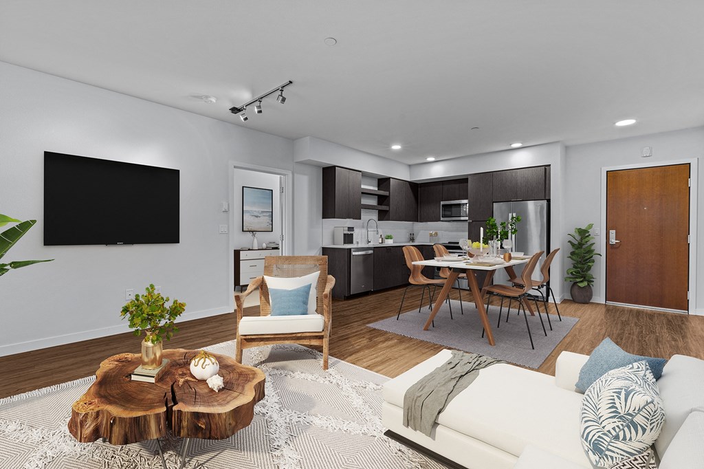 a living room with a couch and a table and a tv