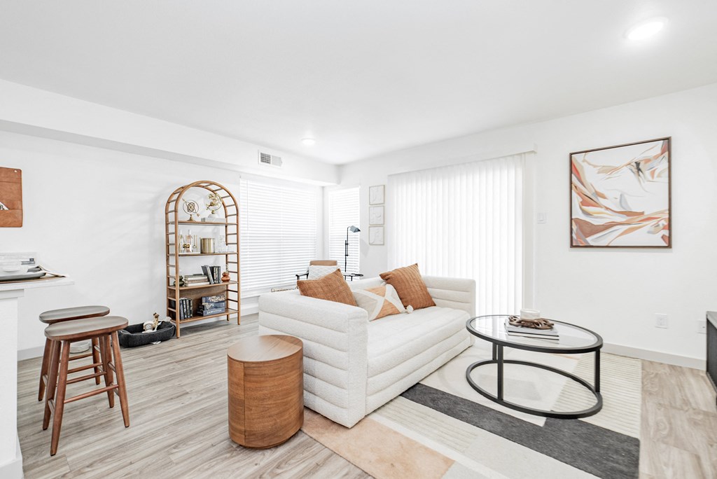 a living room with a couch and a round table