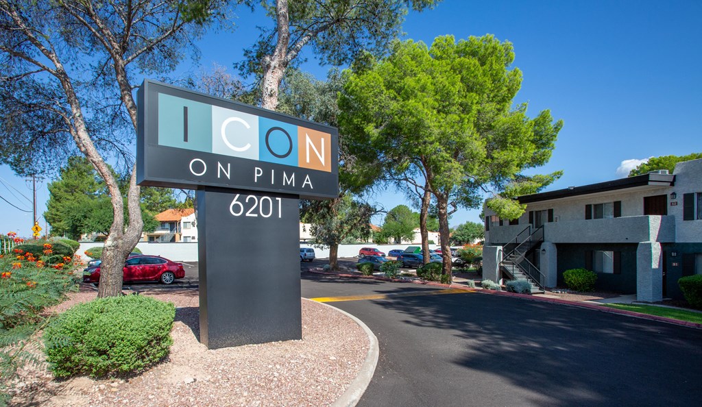 A sign for Icon on Pima 6201 is in front of a building.