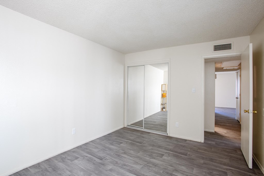 A room with a grey floor and white walls.