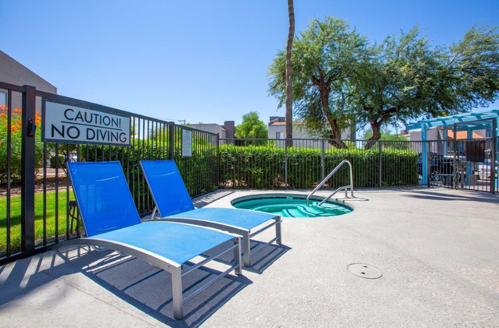 A pool area with a caution no diving sign.