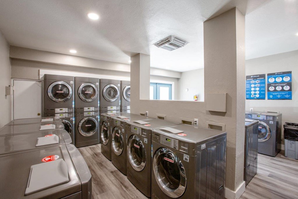A row of washing machines in a public laundromat.