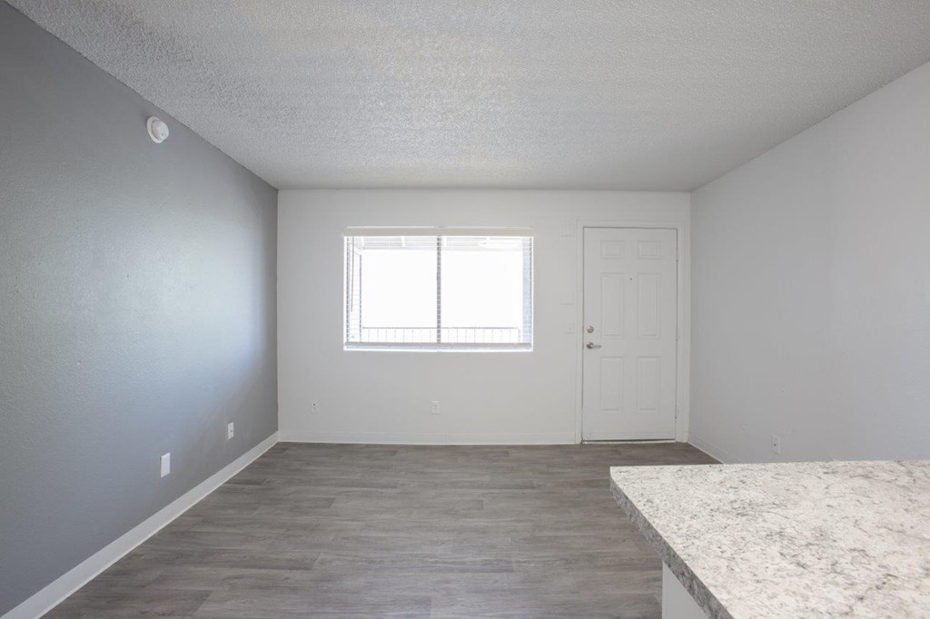 A room with a window and a door.