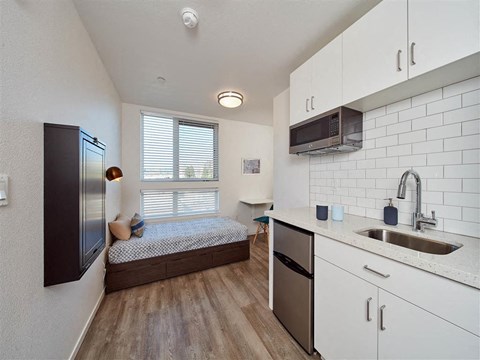a kitchen with a sink next to a window