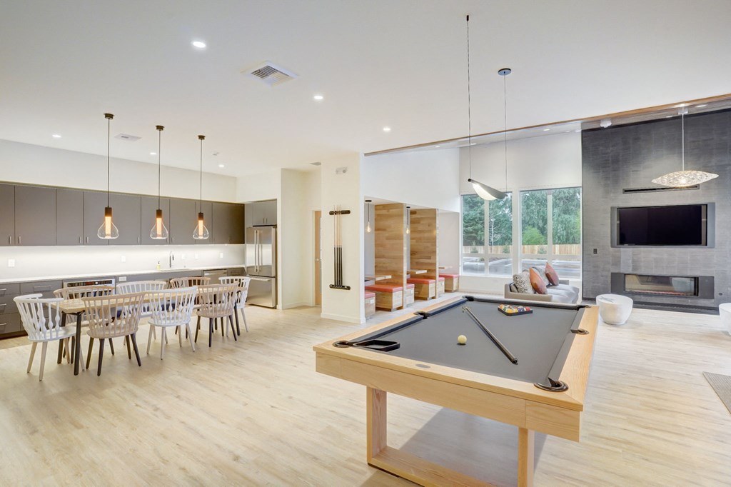 a pool table in the center of a living room