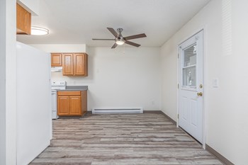 Hood Manor Apartments Dining Room with Ceiling Fan and Hardwood Flooring - Photo Gallery 4