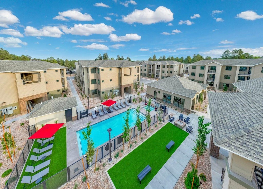 an aerial view of the resort style pool at the residence apartments
