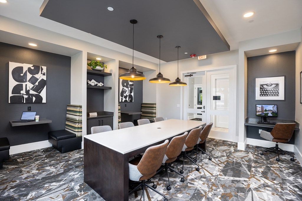 a conference room with a long table and chairs