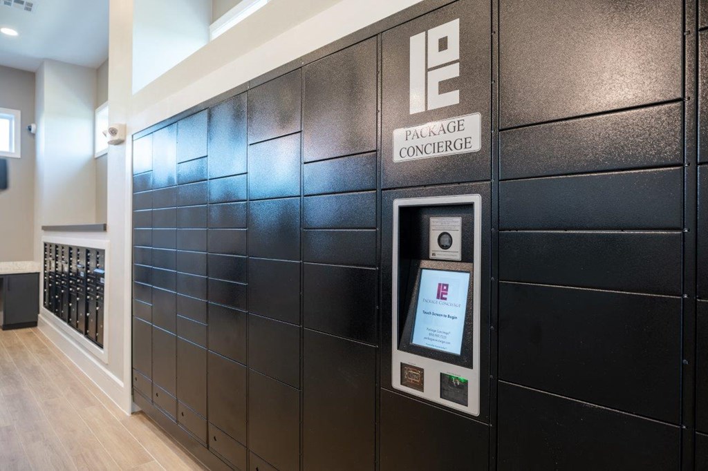 a wall with an automated teller machine in the lobby of a building
