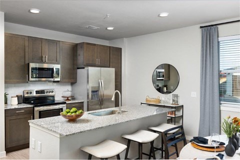 a kitchen with a marble counter top and a