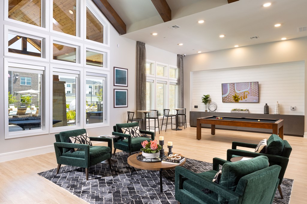 a games room with a foosball table and a billiards table