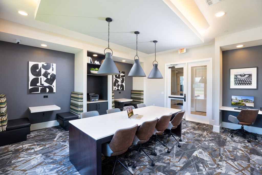 a conference room with a long table and chairs