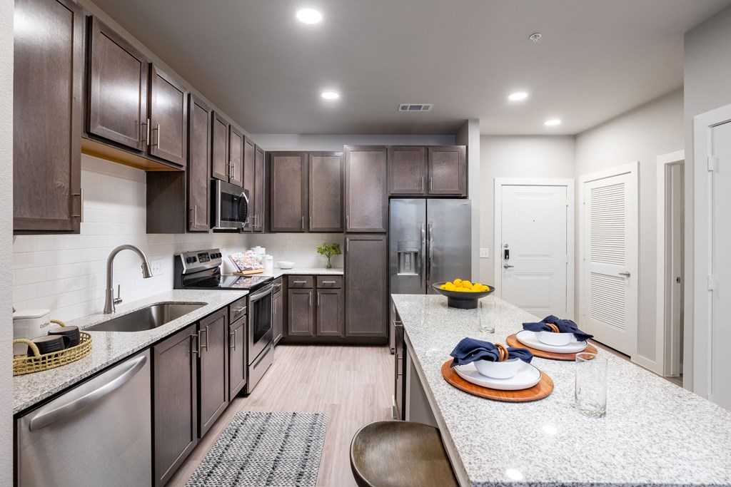 our apartments feature a modern kitchen with stainless steel appliances and granite countertops