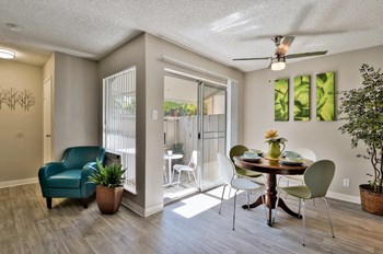 The Park at Idlewild Apartments Model Dining Room and Patio Door - Photo Gallery 6