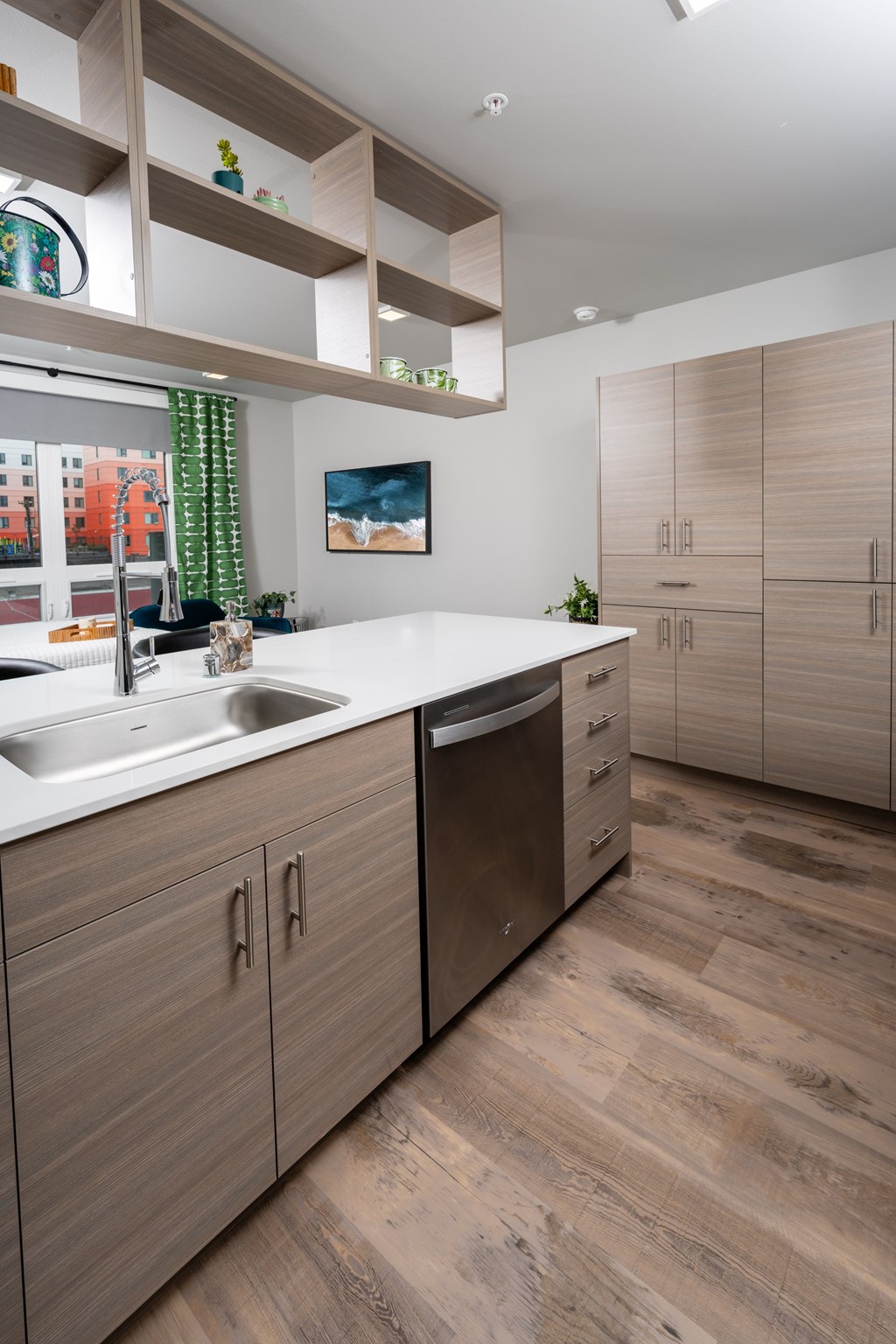 A modern kitchen with wooden cabinets and a white countertop.