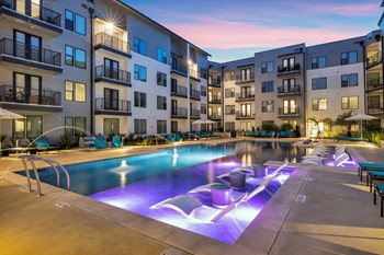 Nexus East Outdoor Pool with Lights and Lounge Chairs Property Image