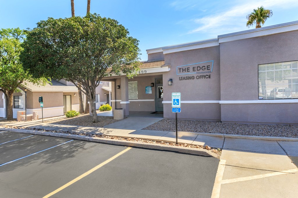 The Edge Leasing Office is located in a parking lot.