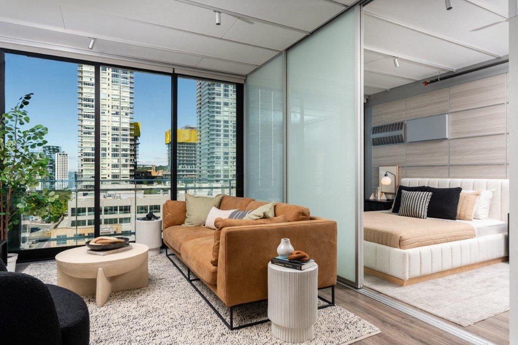 3ZERO3 New Apartments in Seattle, Washington Model Living Room and Bedroom with Divider
