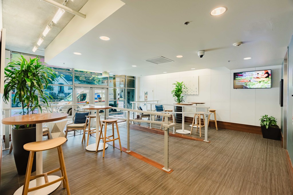 A modern office space with wooden floors and furniture.