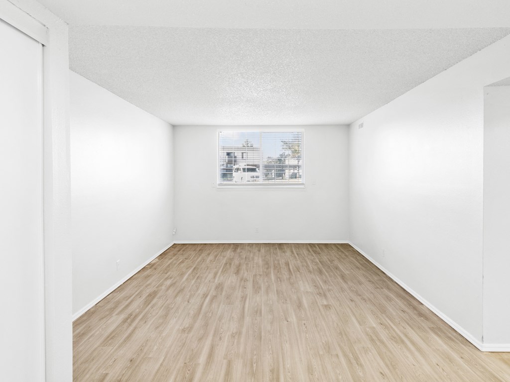 Proximity Apartment Homes Bedroom with Wood like floors