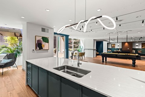 a kitchen with a large island and a pool table