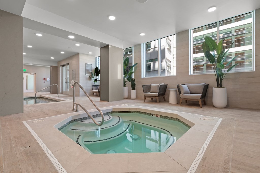 a spa with a pool in the middle of a room