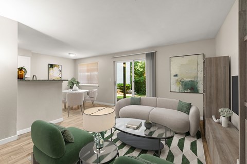 A living room with a green chair and a grey couch.