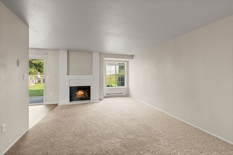 A room with a fireplace and a window.