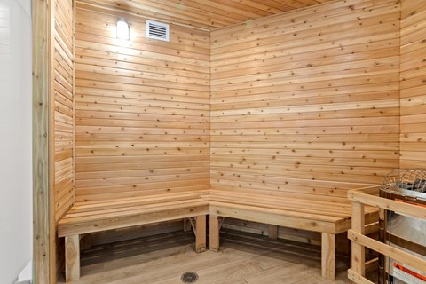 two benches in the corner of a wooden sauna