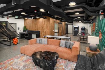 a living room with a couch and a table