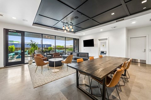 Community lounge leading to outdoor terrace at Grand Belmont Apartments in Central Eastside Portland, Oregon.