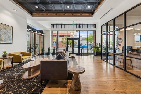 Front lobby with large windows and office at Grand Belmont Apartments in Central Eastside Portland, Oregon.