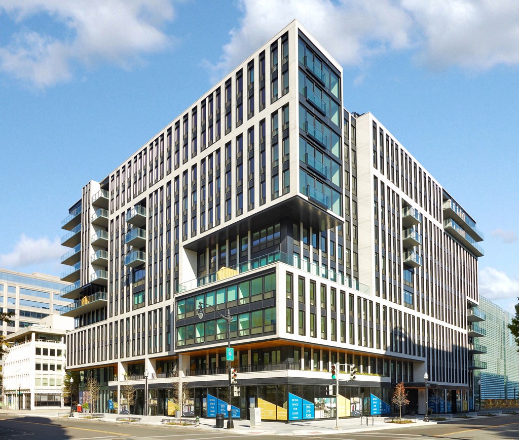 A modern multi-story building with a lot of windows.