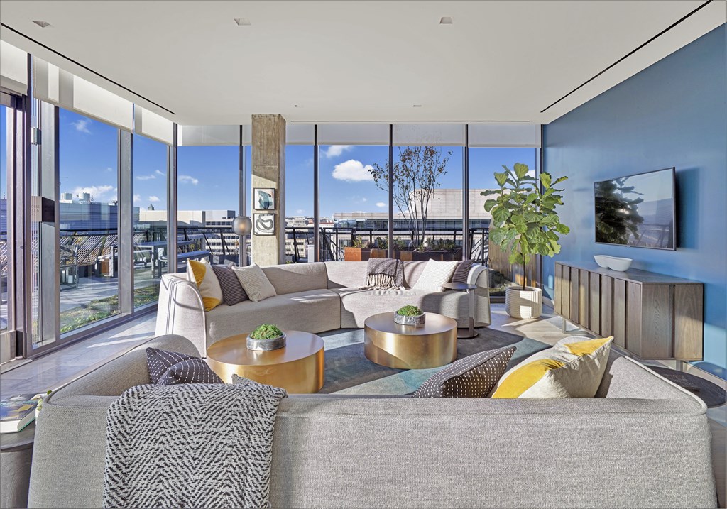 A modern living room with a view of the city.