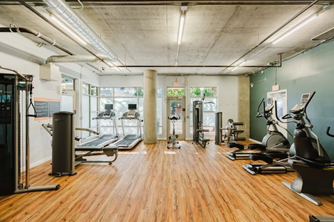 Community gym/fitness center with machines and weights at 2121 Belmont apartments in the Buckman neighborhood in Portland, Oregon.