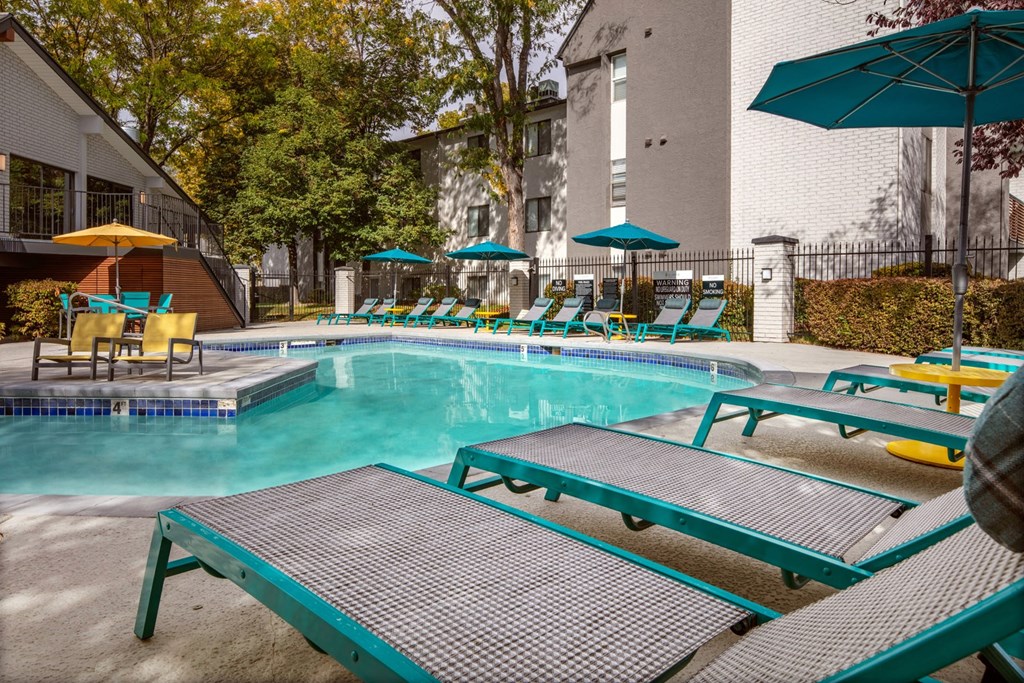 Clover Creek Apartments Pool Area and Lounge Chairs