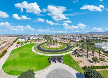 A park with a circular walkway and a monument in the middle.