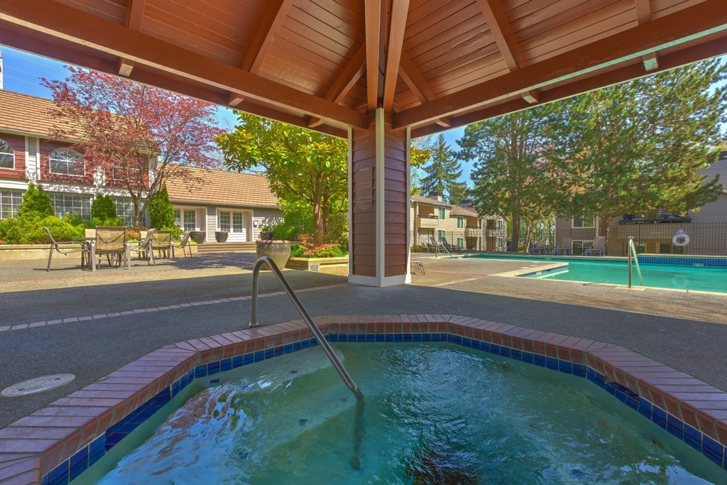 a resort style pool is under a wooden roof