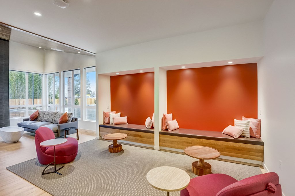 a living room with couches and chairs and a table