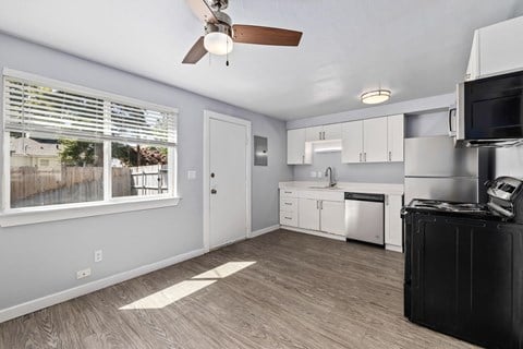 North River Apartments kitchen with a large window and a ceiling fan