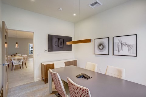 a dining room with a table and chairs