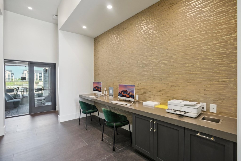 A room with a desk and a chair in front of a wall with a wood grain texture.