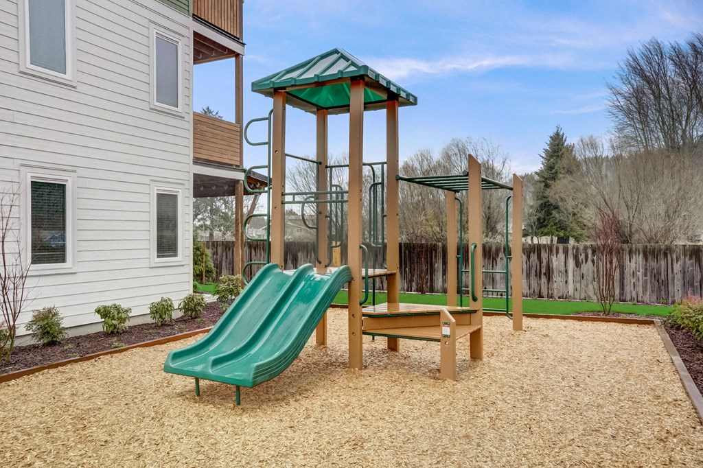 our apartments have a playground with slides and a picnic table